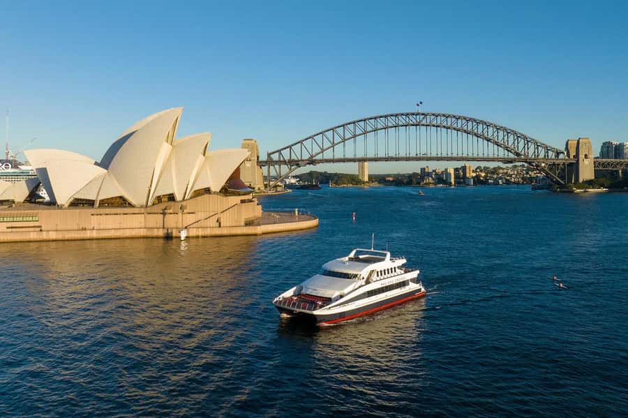 Luxury Catamaran Lunch Cruise with Deluxe Buffet - Sydney Harbour icons: Bridge, Opera House, and Circular Quay from the water